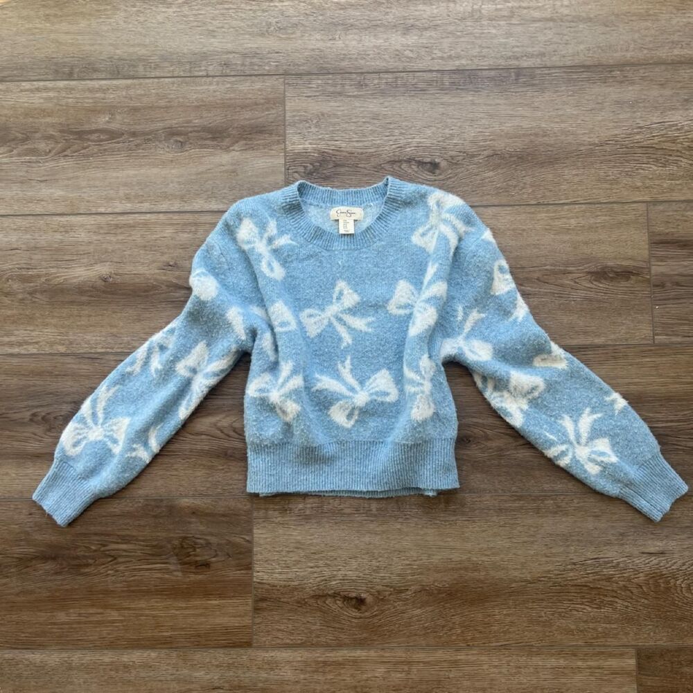 Jessica Simpson blue sweater with white bow pattern, size S-M
